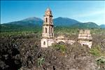 The bell tower emerging from the lava rocks